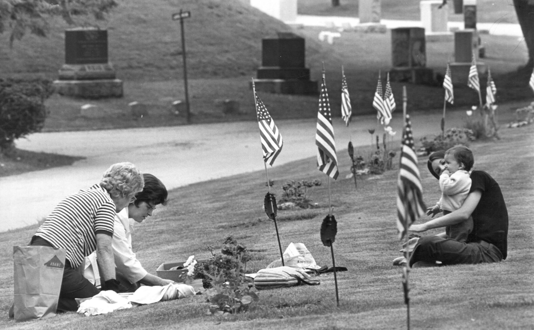Memorial Day, and the week preceeding it brings families, like this one, to the Pittsfield Cemetery.